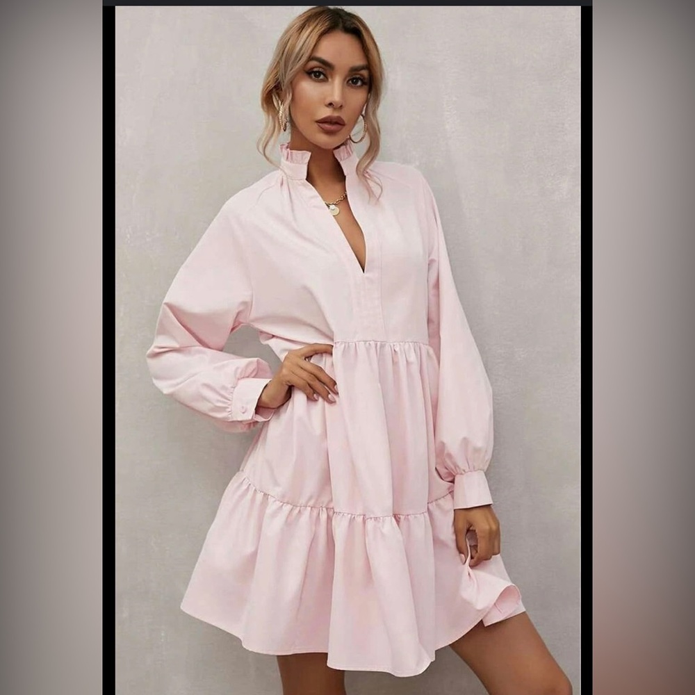 Pink dress with smock neck.